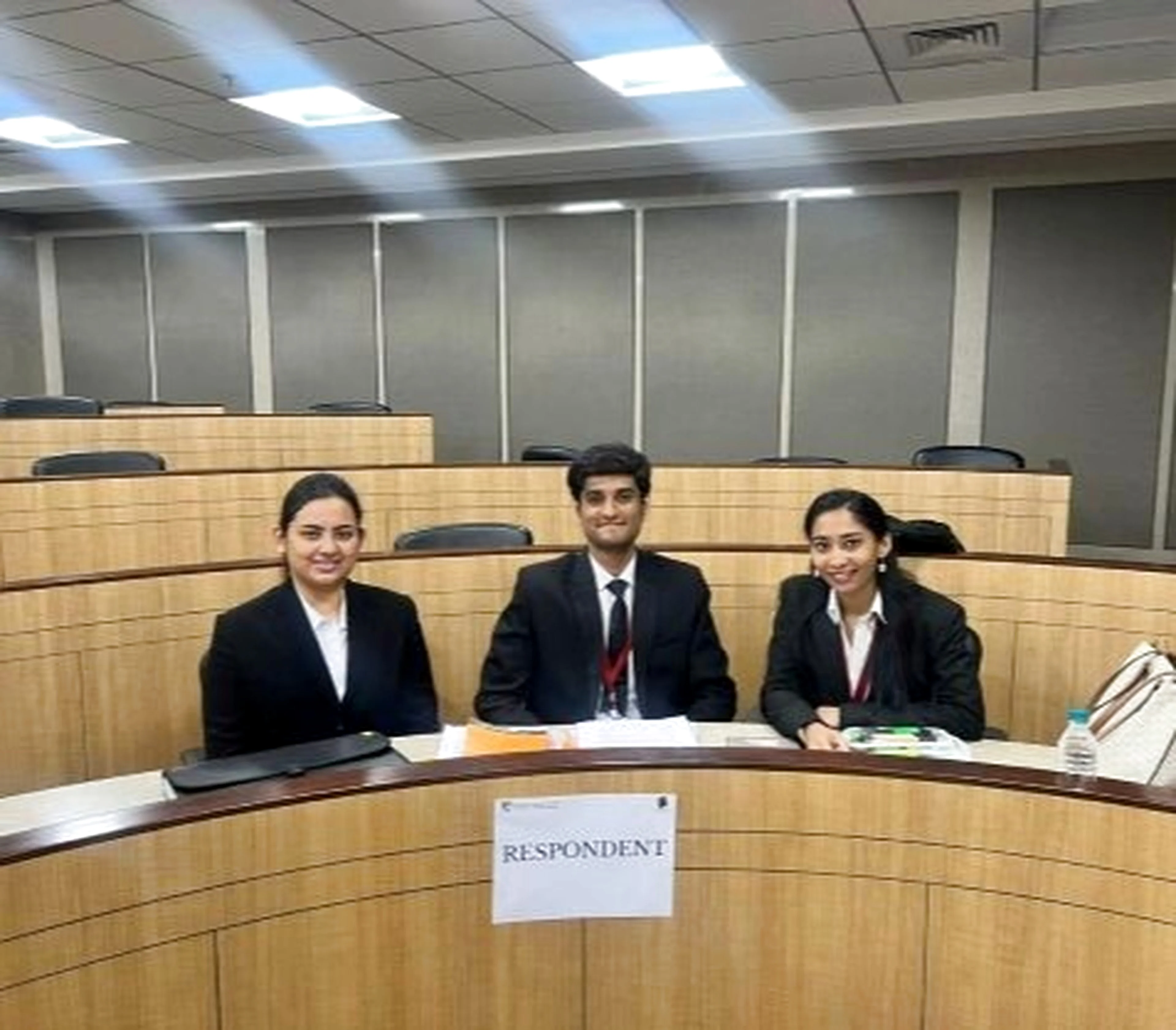 Law students participating in moot courtroom trial